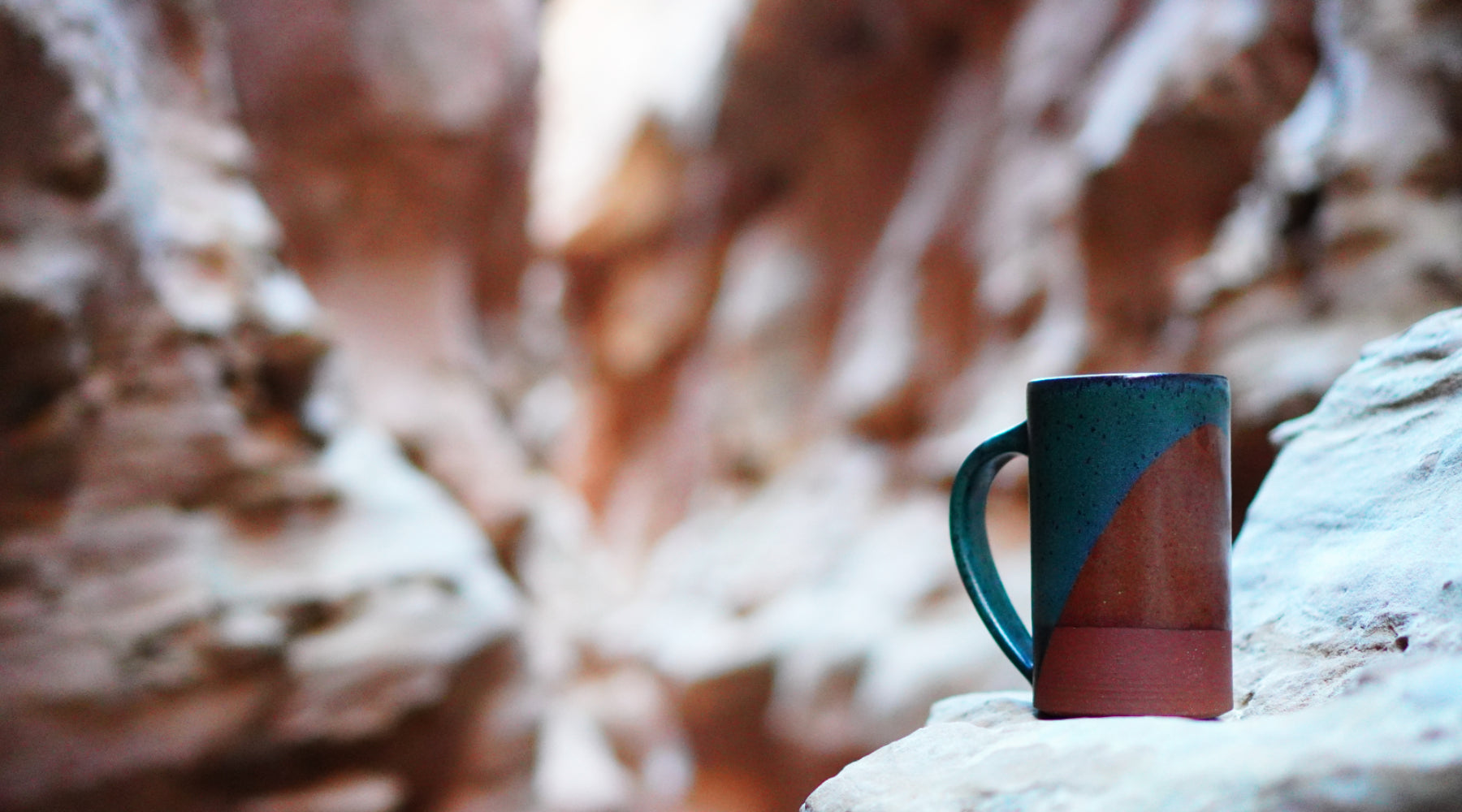 Handmade Stoneware Ceramic Mug in Midnight Desert Blue Glaze combo, in a slot canyon
