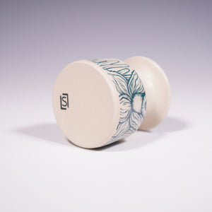 Wheel thrown ceramic mini vase with hand-painted daffodil underglaze design. (Bottom View)