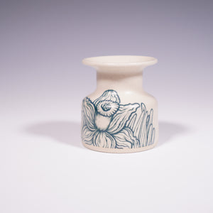 Wheel thrown ceramic mini vase with hand-painted daffodil underglaze design. (Front View)