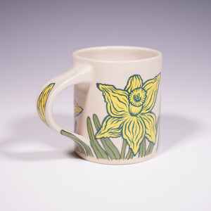 Wheel Thrown Ceramic Mug with Hand-Painted daffodil design. (Front View)