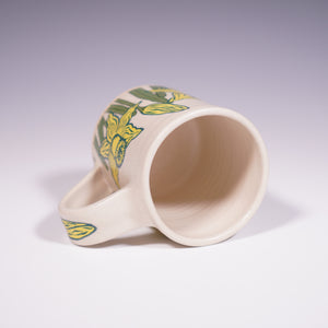 Wheel Thrown Ceramic Mug with Hand-Painted daffodil design. (Top View)