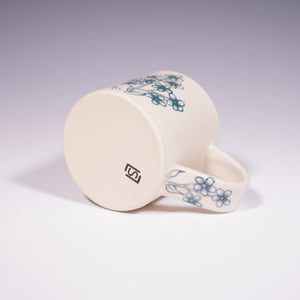 Wheel Thrown Ceramic Mug with Hand-painted Forget Me Nots Design. (Bottom View)