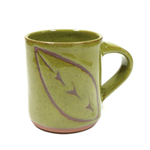 Wheelthrown red stoneware mug with a hand-painted leaf motif & speckled green glaze 