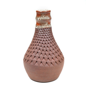 Wheelthrown red stoneware vase textured by handpressing one indent at a time