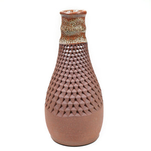 Wheelthrown red stoneware vase textured by handpressing one indent at a time