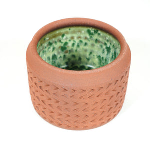 Wheelthrown red stoneware lidded jar with hand textured pattern (bright speckled green glaze on inside)