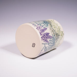 Ceramic vase with mountain and floral design on a white background (Bottom 
View)