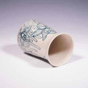 Wheel thrown ceramic vase with hand-painted daffodil underglaze design. (Top View)